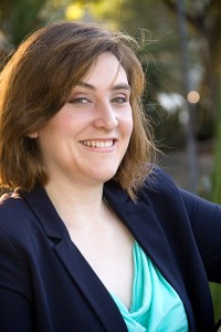 Photograph of Siobhan G Armstrong smiling and wearing a business casual outfit